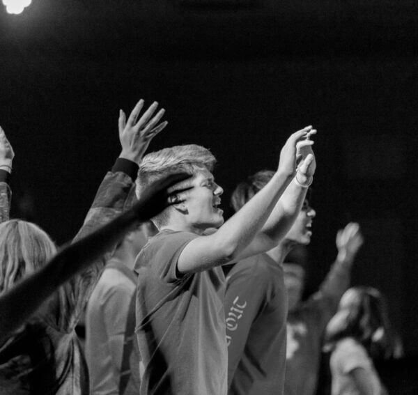 group of young men in christian gap program, Ziklag, with hands up worshiping