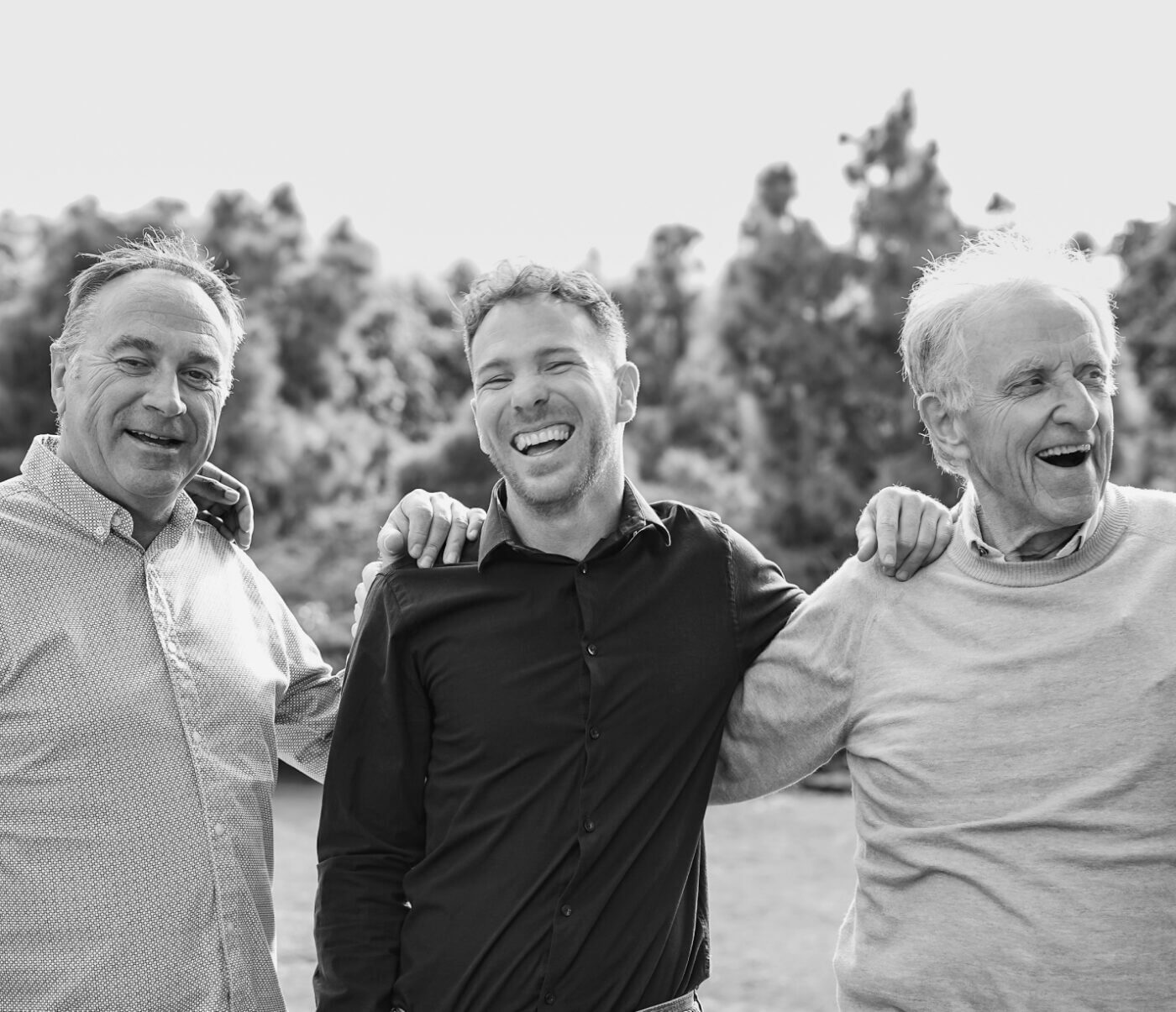 Group of 3 ziklag leaders smiling with arms around each other